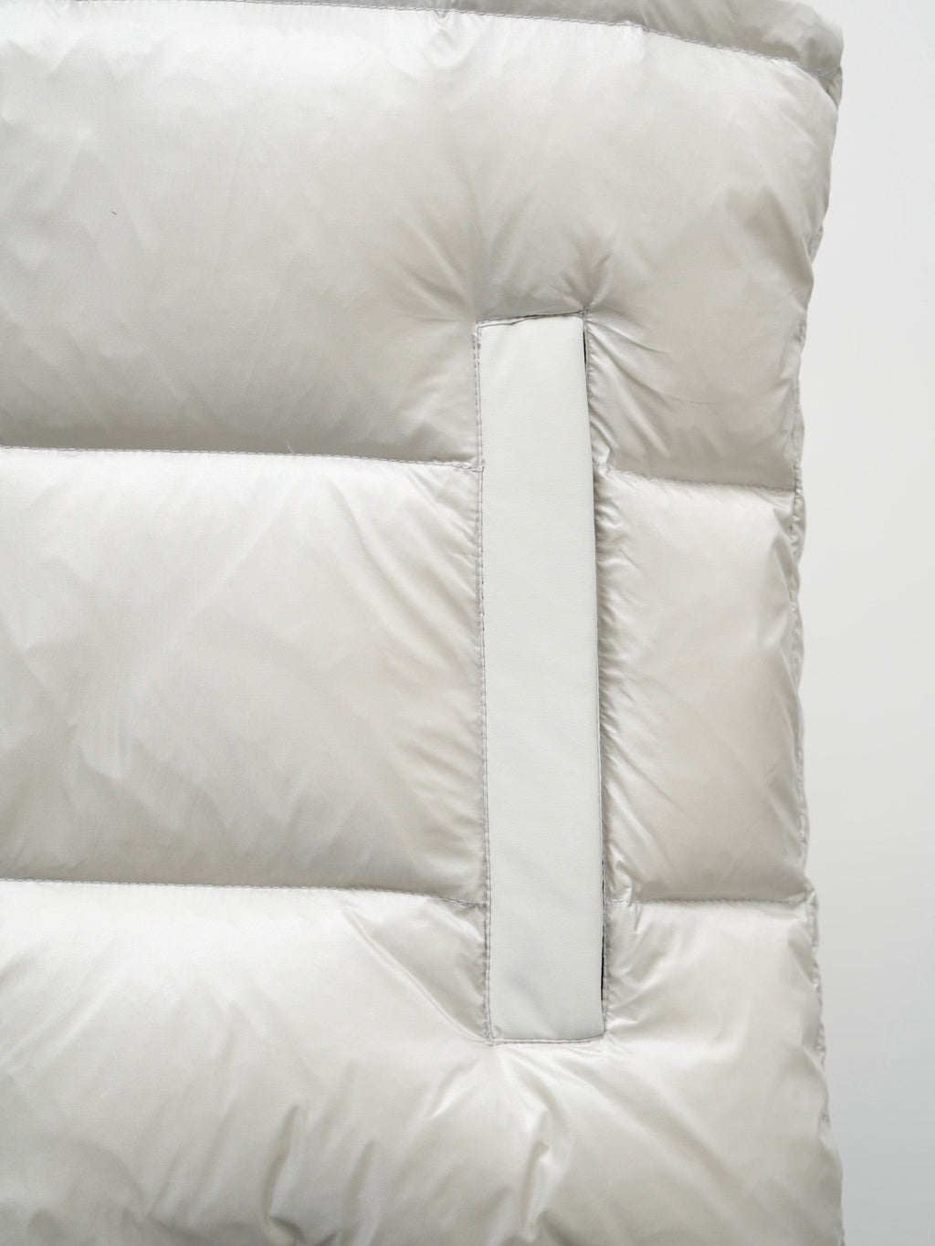 Moose Knuckles Puffer Vest in White with Stand Collar and Metallic Logo