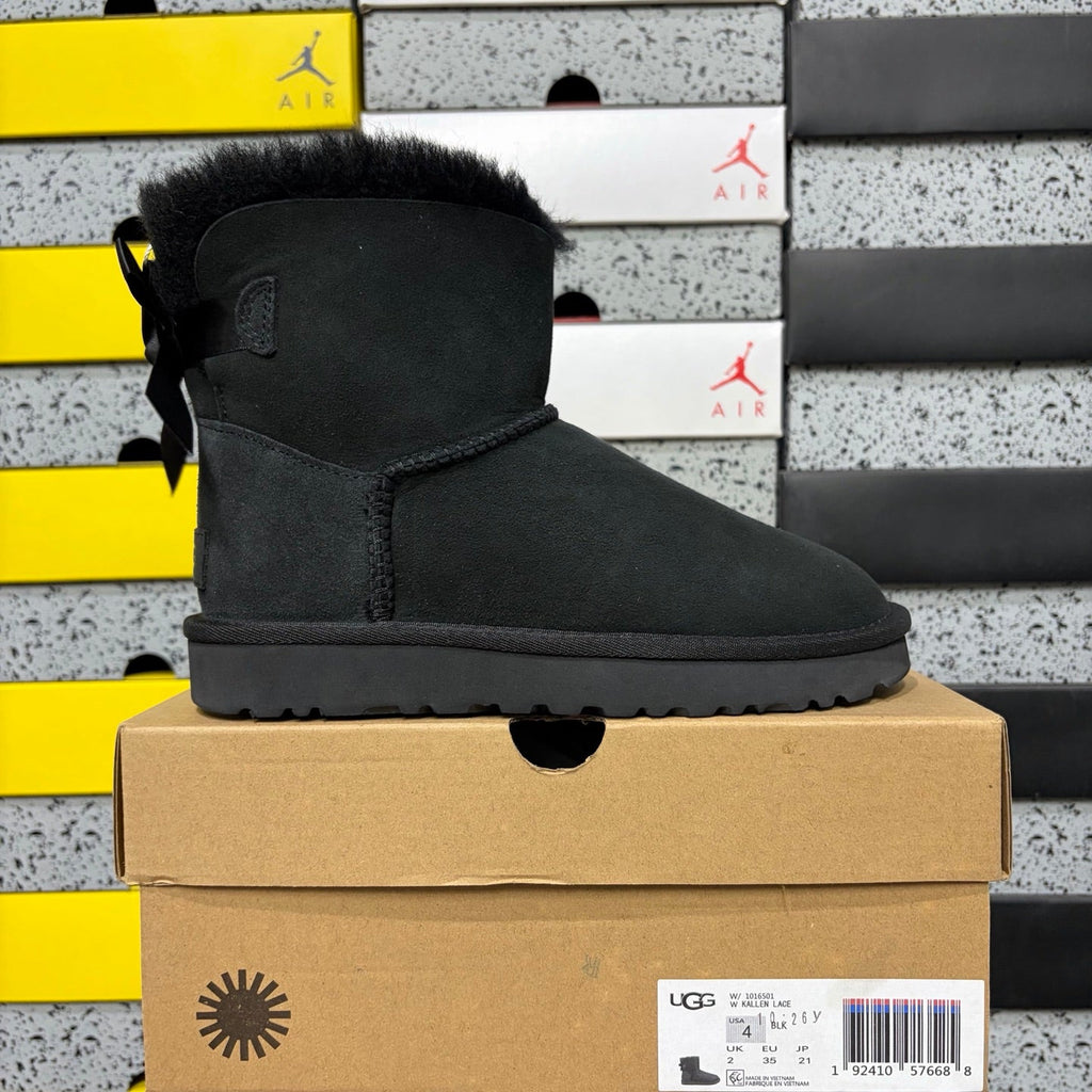 UGG Mini Bailey Bow Ankle Boot – Suede Boot with Tonal Black Shearling Lining, Black Satin Bow & All-Black Lug Sole in Black